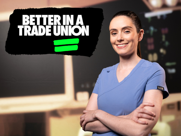 Nurse standing with a better in a trade union logo in background